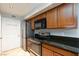 Kitchen area featuring stainless steel appliances, tile floors, and granite countertops at 2300 E Silverado Ranch Blvd # 1037, Las Vegas, NV 89183