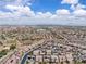 High angle shows a large community filled with similar homes with desert landscaping at 2833 Athena Hill Ct, Henderson, NV 89052