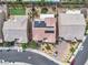 An aerial view shows the lovely community, including a pool, green spaces, and solar panels on the home's roof at 2833 Athena Hill Ct, Henderson, NV 89052