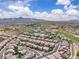 Expansive aerial view of a residential area with uniform rooftops, showcasing the community's layout and desert surroundings at 2833 Athena Hill Ct, Henderson, NV 89052
