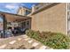 A charming backyard offers privacy with lush bushes and an outdoor seating area at 2833 Athena Hill Ct, Henderson, NV 89052