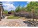 Beautiful backyard with lush landscaping, mature trees and a charming patio area for outdoor relaxation at 2833 Athena Hill Ct, Henderson, NV 89052