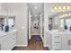 Bright bathroom with double vanities, mirrors, and walk-in shower at 2833 Athena Hill Ct, Henderson, NV 89052