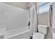 Bathroom featuring a shower-tub combo with a curtain and window for natural light at 2833 Athena Hill Ct, Henderson, NV 89052