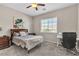Cozy bedroom featuring a ceiling fan, natural light, and comfortable furnishings at 2833 Athena Hill Ct, Henderson, NV 89052