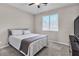 Bedroom featuring carpeted floors, window and a full sized bed and furnishings at 2833 Athena Hill Ct, Henderson, NV 89052
