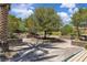 Inviting community park with stone-lined landscaped seating areas, perfect for relaxing outdoors at 2833 Athena Hill Ct, Henderson, NV 89052