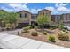 Charming two-story home featuring desert landscaping, a brick driveway, and a cozy balcony at 2833 Athena Hill Ct, Henderson, NV 89052