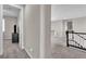 Carpeted hallway with open view into bedroom and staircase to the upper level at 2833 Athena Hill Ct, Henderson, NV 89052