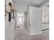 Upstairs hallway featuring carpet flooring, neutral walls, and open doorway at 2833 Athena Hill Ct, Henderson, NV 89052