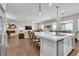 Open concept kitchen with a large island, stainless steel appliances, and seamless flow into the living area at 2833 Athena Hill Ct, Henderson, NV 89052