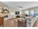 Open living room boasts a decorative fireplace, neutral paint, and access to the backyard at 2833 Athena Hill Ct, Henderson, NV 89052