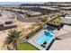 Expansive aerial view of the neighborhood showcasing backyard with pool, spa, putting green, and outdoor kitchen at 3120 Greenscape Ln, Las Vegas, NV 89138