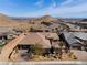 Aerial view of the home showcasing the desert landscape and tile roof at 3120 Greenscape Ln, Las Vegas, NV 89138