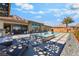 Beautiful backyard featuring a pool, spa, outdoor seating, and mountain views at 3120 Greenscape Ln, Las Vegas, NV 89138