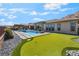 Amazing backyard with putting green, pool and desert landscaping at 3120 Greenscape Ln, Las Vegas, NV 89138