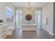 Bright bathroom with soaking tub, dual glass enclosed showers and contemporary lighting at 3120 Greenscape Ln, Las Vegas, NV 89138
