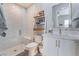 The bathroom features a glass enclosed shower, toilet, vanity, and ladder style shelving unit at 3120 Greenscape Ln, Las Vegas, NV 89138