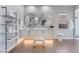 Bright bathroom with dual sinks, sleek white cabinets, and decorative lighting at 3120 Greenscape Ln, Las Vegas, NV 89138