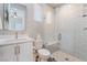 Bright bathroom featuring a walk-in shower, vanity with gold hardware, and modern fixtures at 3120 Greenscape Ln, Las Vegas, NV 89138