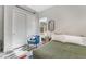 This bedroom features a stylish chair, comfortable bed, and modern décor at 3120 Greenscape Ln, Las Vegas, NV 89138