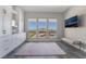 Bedroom with mountain view, built-in cabinets, and tile flooring at 3120 Greenscape Ln, Las Vegas, NV 89138