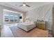 Spacious bedroom featuring a modern accent wall, ceiling fan, and mountain views at 3120 Greenscape Ln, Las Vegas, NV 89138