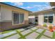 Private courtyard featuring artificial grass and concrete pavers, enhancing outdoor living at 3120 Greenscape Ln, Las Vegas, NV 89138