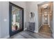 Modern entryway showcasing stylish decor, wood-look tile flooring, and a sleek front door at 3120 Greenscape Ln, Las Vegas, NV 89138