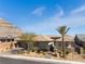 Exterior of home featuring desert landscaping, a tile roof, and mountain views at 3120 Greenscape Ln, Las Vegas, NV 89138