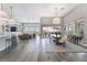 Spacious living room with high ceilings, large windows, modern decor, and an open floor plan at 3120 Greenscape Ln, Las Vegas, NV 89138