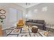 Cozy living room with large window, stylish rug, and comfortable seating at 3120 Greenscape Ln, Las Vegas, NV 89138
