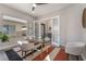 Office space with glass-top desk, neutral decor, and access to outdoor views at 3120 Greenscape Ln, Las Vegas, NV 89138