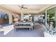 Covered outdoor dining area with kitchen and views at 3120 Greenscape Ln, Las Vegas, NV 89138