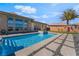 Backyard pool and outdoor lounge area at 3120 Greenscape Ln, Las Vegas, NV 89138