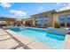 Stunning pool with lounge area and views of backyard at 3120 Greenscape Ln, Las Vegas, NV 89138