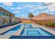 Luxury pool and spa with elegant design and desert landscape, perfect for relaxation at 3120 Greenscape Ln, Las Vegas, NV 89138