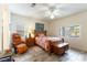 Cozy bedroom featuring wood-look flooring and ample natural light at 3215 Stratford Hall Ct, Las Vegas, NV 89135