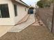 Home's backyard features rock landscaping and a walkway along the home's exterior at 331 Mount Hope St, Henderson, NV 89014