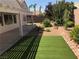 Backyard featuring a patio, artificial grass and rock landscaping at 331 Mount Hope St, Henderson, NV 89014