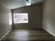 Comfortable bedroom with vaulted ceiling, wood-look floors, and lots of natural light at 331 Mount Hope St, Henderson, NV 89014