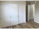 Bedroom featuring a closet with sliding doors and wood-look flooring at 331 Mount Hope St, Henderson, NV 89014