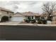 Inviting single-story home featuring a two-car garage and low-maintenance desert landscaping at 331 Mount Hope St, Henderson, NV 89014