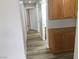 Hallway featuring wood-look floors and wood cabinets at 331 Mount Hope St, Henderson, NV 89014