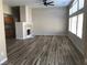 Bright living room with high ceilings, wood flooring, and fireplace feature at 331 Mount Hope St, Henderson, NV 89014