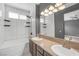 Spacious bathroom has double sinks, a tub, tiled walls, and recessed lighting at 3441 Mountain Park St, Las Vegas, NV 89129