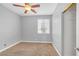 Bright, carpeted bedroom includes a window, ceiling fan, and closet at 3441 Mountain Park St, Las Vegas, NV 89129