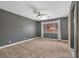 Spacious carpeted bedroom features a ceiling fan, a window, and neutral paint at 3441 Mountain Park St, Las Vegas, NV 89129