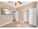 Comfortable bedroom features a ceiling fan, closet, and a wall-mounted television at 3441 Mountain Park St, Las Vegas, NV 89129