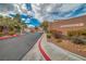 Gated community entrance with well-maintained landscaping and scenic mountain views at 3441 Mountain Park St, Las Vegas, NV 89129
